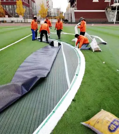 Install Shock Pad → Lay Artificial Turf → Apply Line Markings